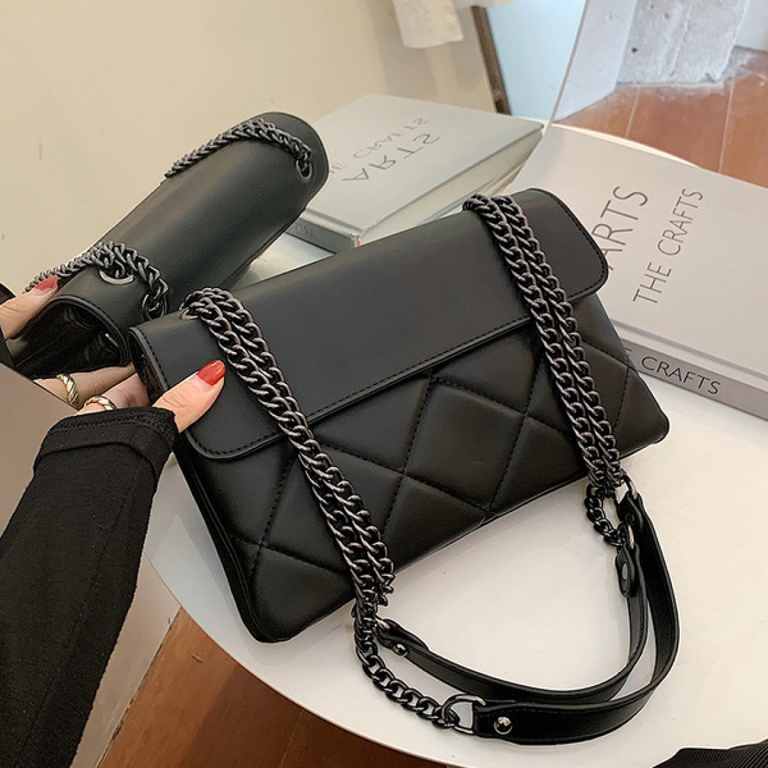 Black quilted chain shoulder bag for women front view